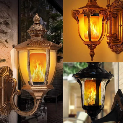 Flame bulbs in outdoor wall lanterns at night
