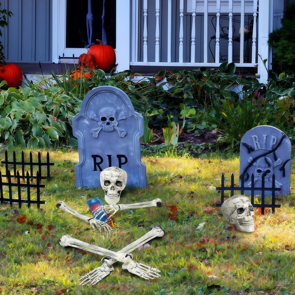 Skeleton yard stakes in a front-yard graveyard scene