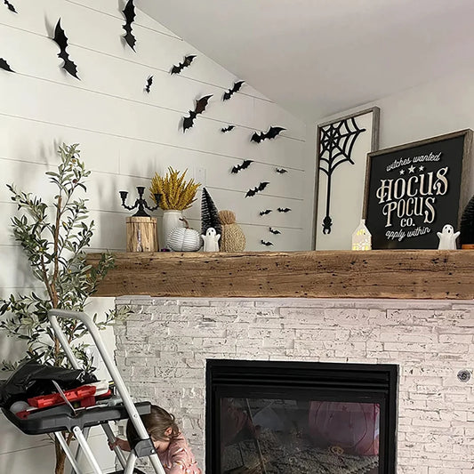 3D black bats flying across a living room wall above a fireplace