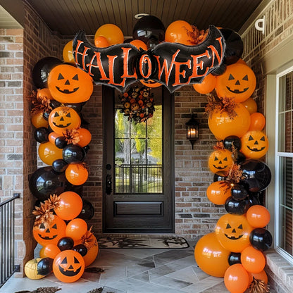 Orange and black Halloween balloon arch over a front door with HALLOWEEN banner