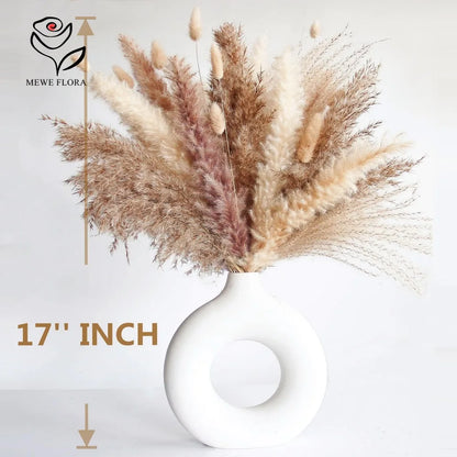 Dried pampas grass bouquet in a white vase
